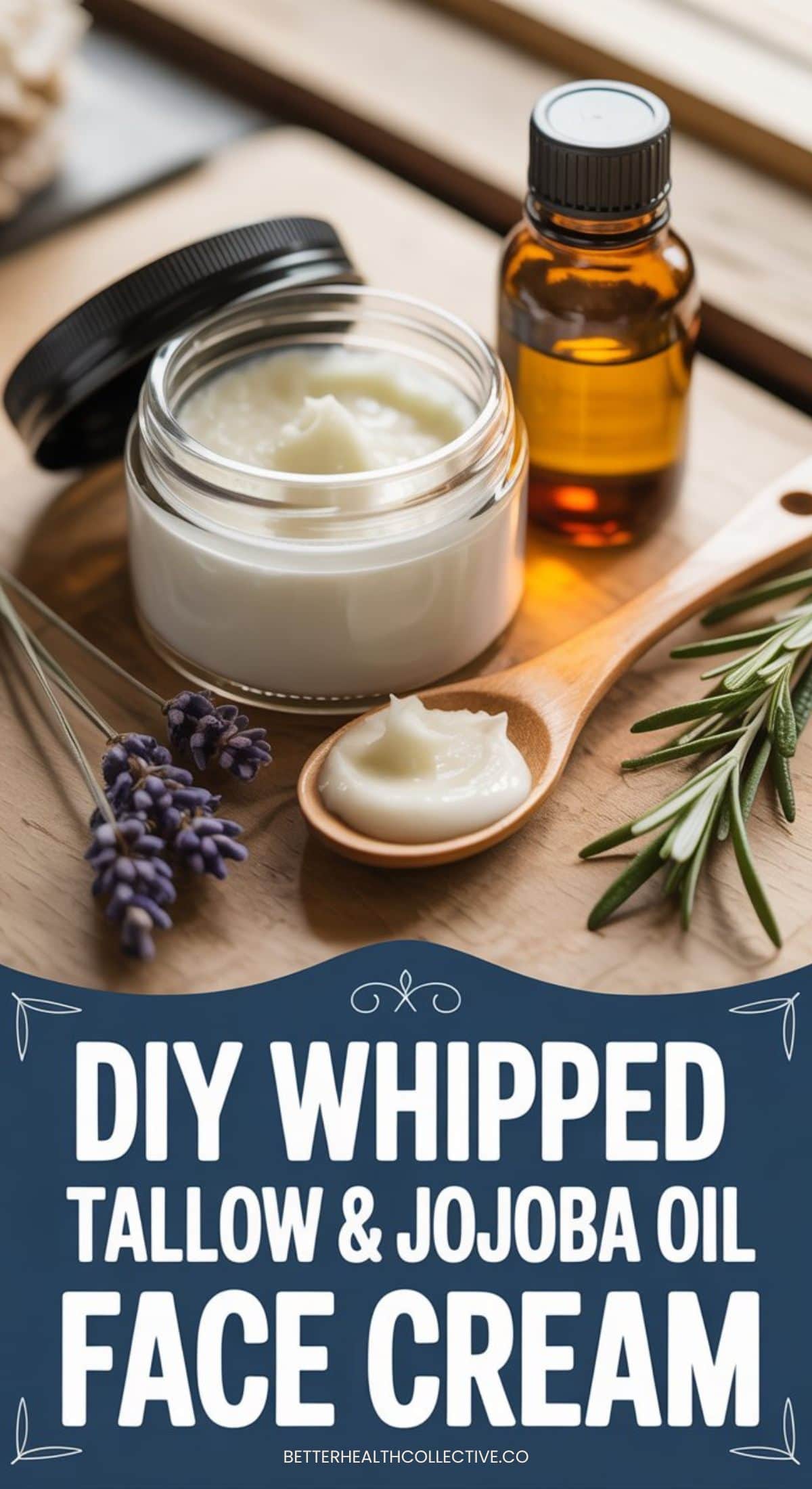 A jar of DIY Whipped Tallow face cream sits on a wooden surface with a small wooden spoon, brown glass bottle, lavender sprigs, and rosemary nearby. Text reads: DIY Whipped Tallow & Jojoba Oil Face Cream.