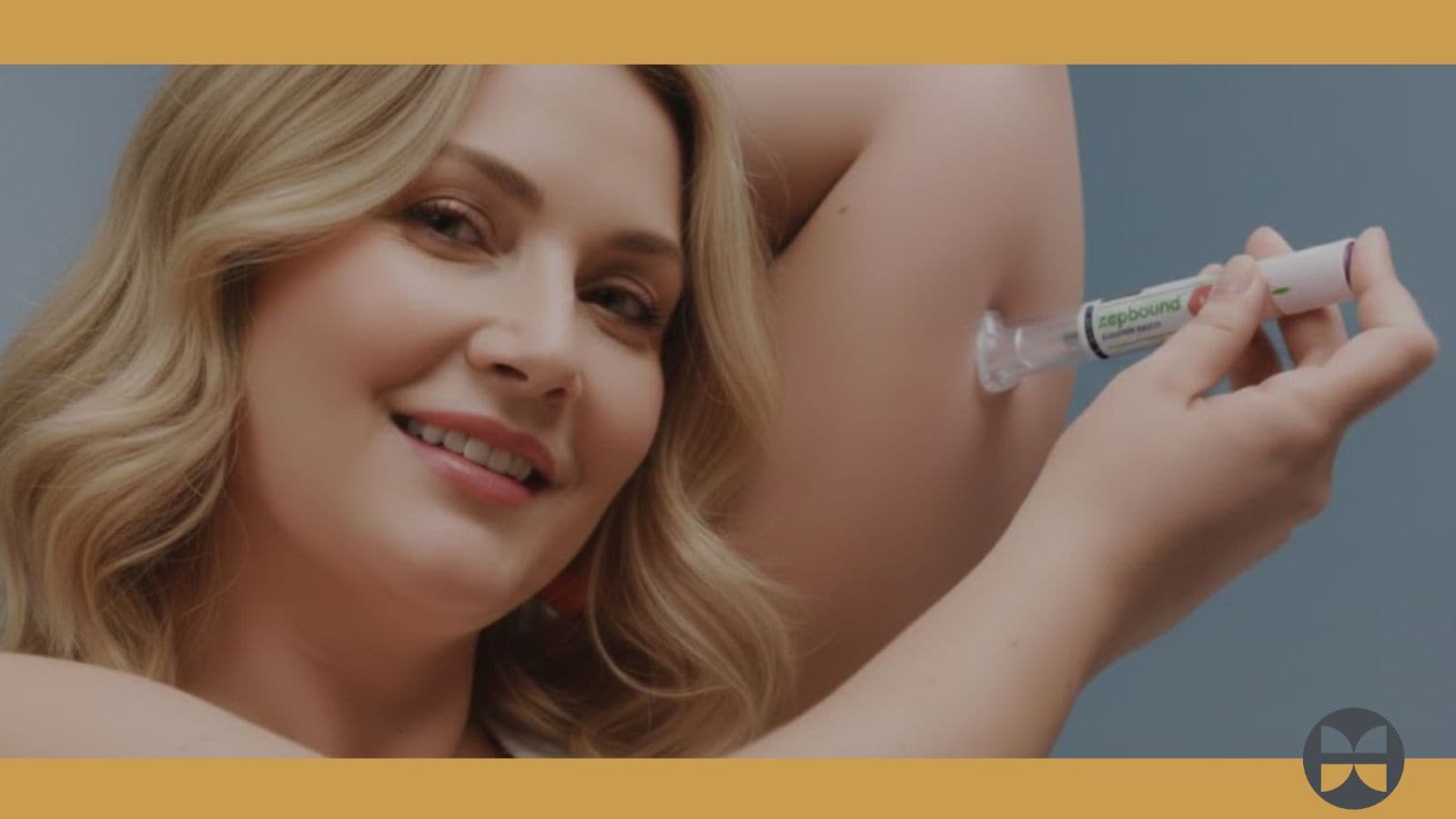 A smiling woman with wavy blonde hair applies a cream or gel from a tube to her underarm, showing where to take care for best results. The blue background has orange borders and a small circular logo in the lower right corner.