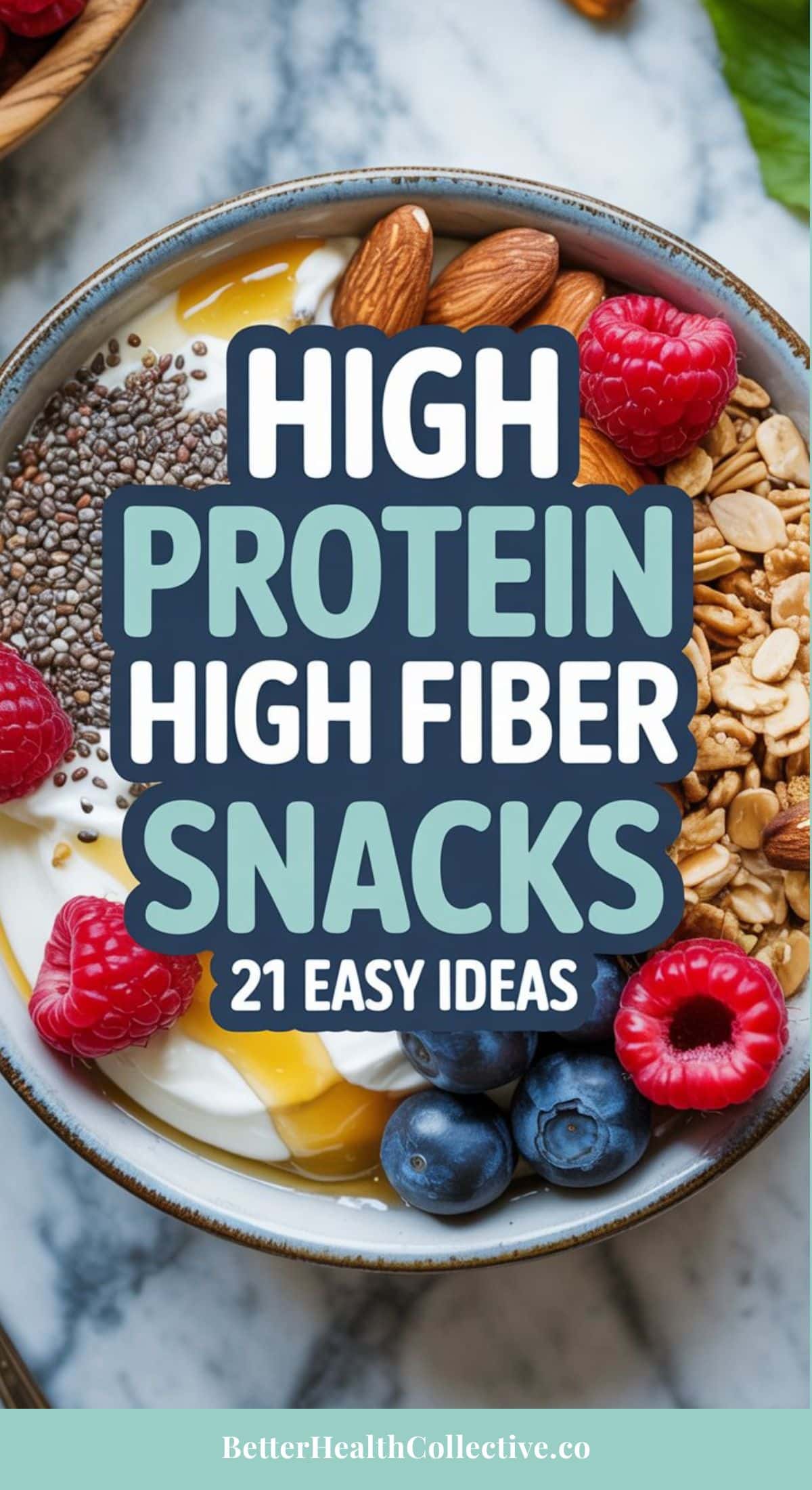 A bowl of yogurt topped with raspberries, blueberries, chia seeds, almonds, and granola. Text overlay reads: High protein, fiber snack ideas—21 easy options.